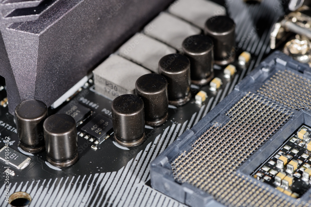 Naklejka premium Close up on the cpu socket, focus on the surrounding capacitors