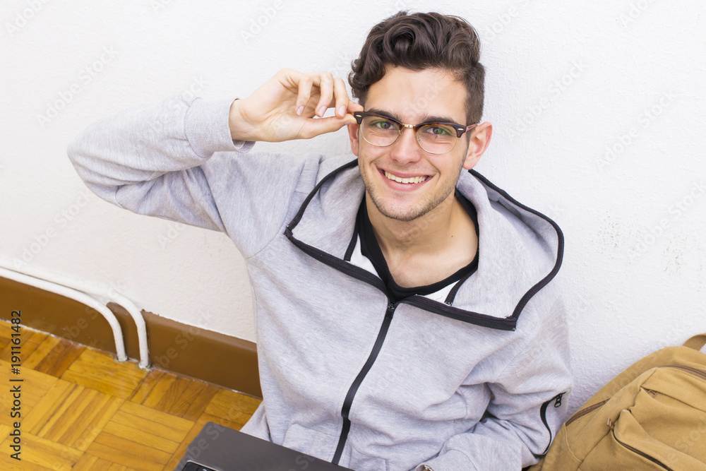 student with the computer and backpack of the college or university