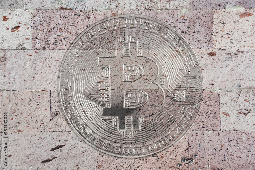 Natural pink tuff surface with image of bitcoin