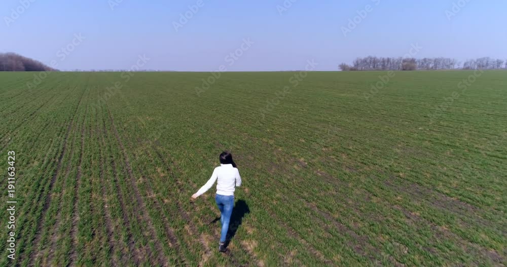 Running brunette rejoices outdoors, slow motion Running brunette rejoices outdoors, slow motion