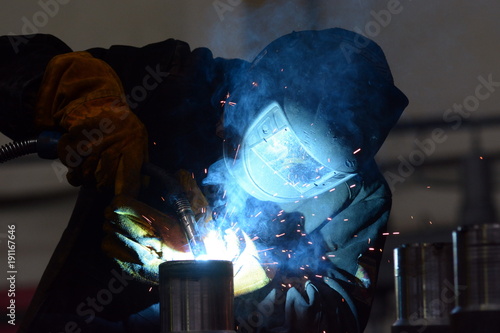 Working at the plant makes welding and cutting of metal photo