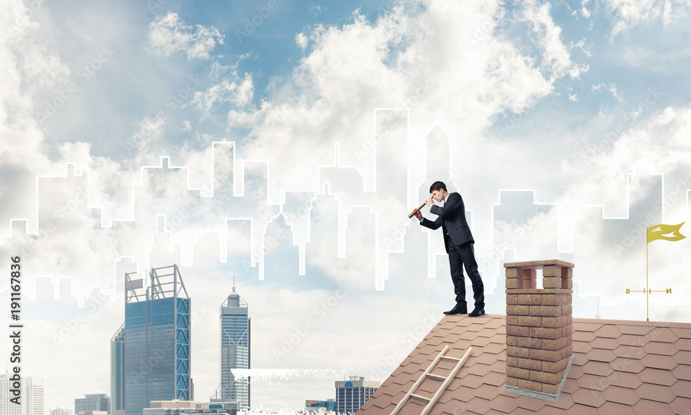 Engineer man standing on roof and looking in spyglass. Mixed med Engineer man standing on roof and looking in spyglass. Mixed med