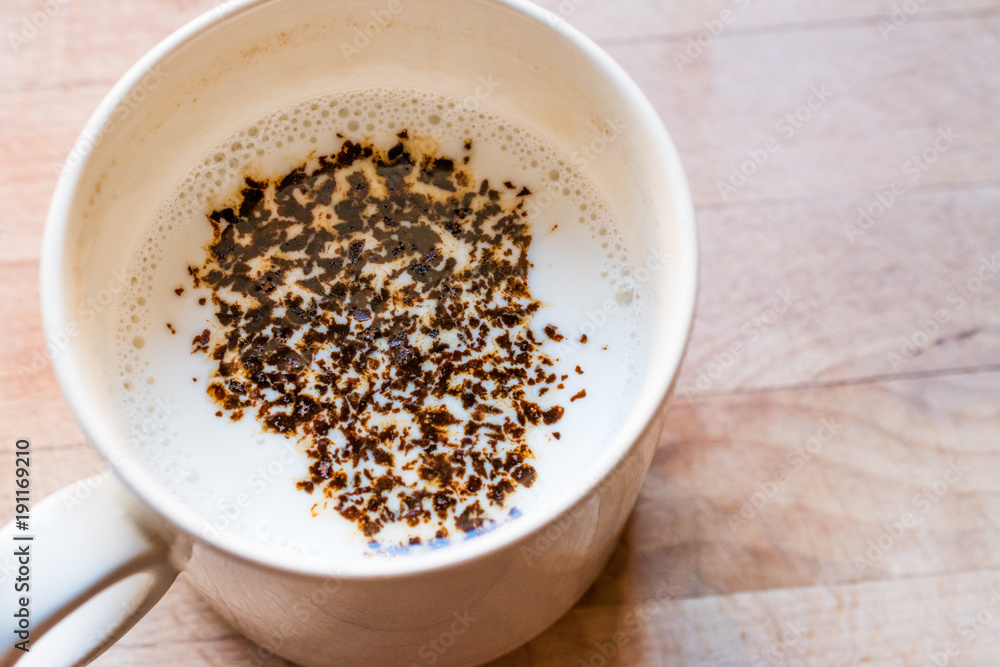 Instant Granulated Coffee Powder with Milk in Cup Instant Granulated Coffee Powder with Milk in Cup