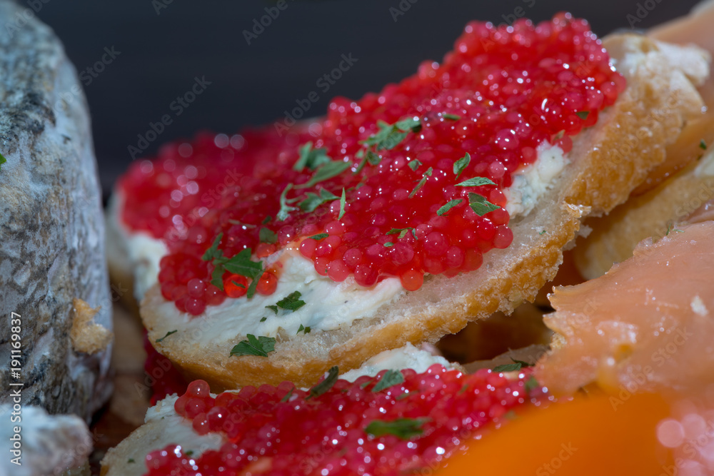 a beautifully laid table with refreshments and red caviar a beautifully laid table with refreshments and red caviar