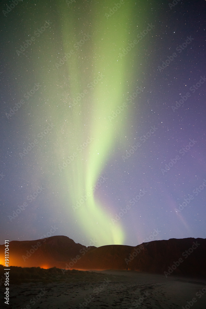 Aurora borealis at the beach in Lofoten area in Norway