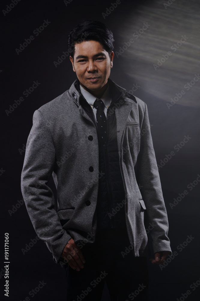 Portrait half body, Business Man Stand in gray coat white shirt black pants, studio Portrait half body, Business Man Stand in gray coat white shirt black pants, studio