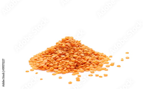 Pile of red lentils isolated on white background