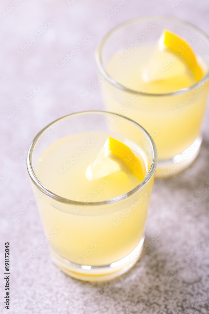 Italian lemon lime liqueur limoncello with ice and mint Italian lemon lime liqueur limoncello with ice and mint