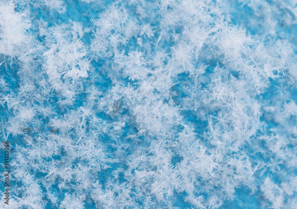 white snowflakes on a blue background white snowflakes on a blue background