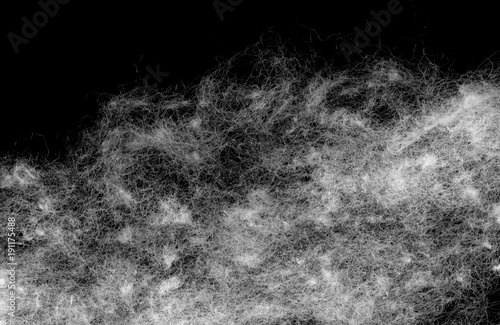 Medical cotton wool isolated on a black background. Highly detailed texture.