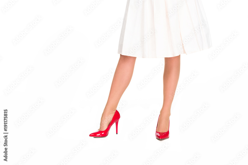 cropped shot of woman in red high heels and skirt isolated on white cropped shot of woman in red high heels and skirt isolated on white