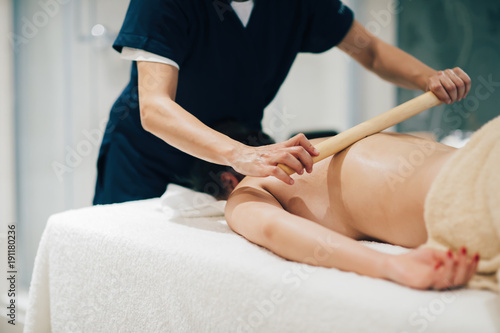 Masseur massaging masseuse at wellness resort © NDABCREATIVITY