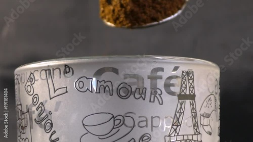 Pour ground coffee into a cup