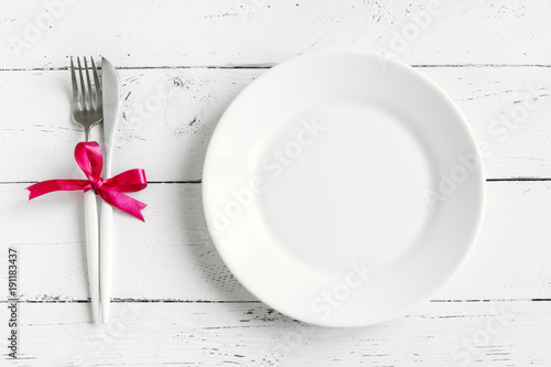 Table setting with red ribbon