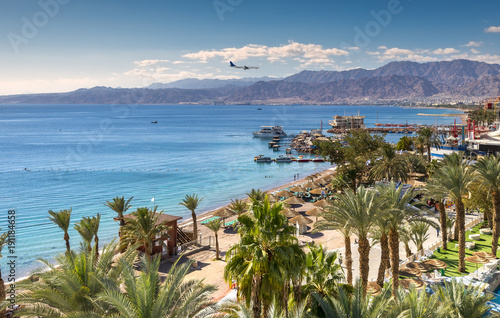 Central beach and marina in Eilat - famous resort and recreation city in Israel. This serene location is a very popular tropical getaway for Israeli and European tourists. 