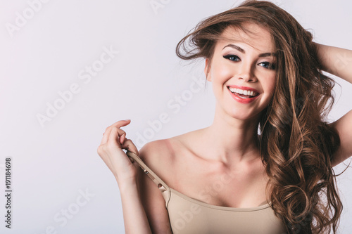Woman. Smiling girl with long healthy hair.