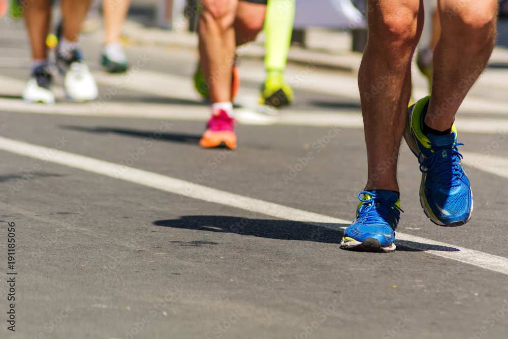 Fototapeta premium detail of running shoes of marathon runners