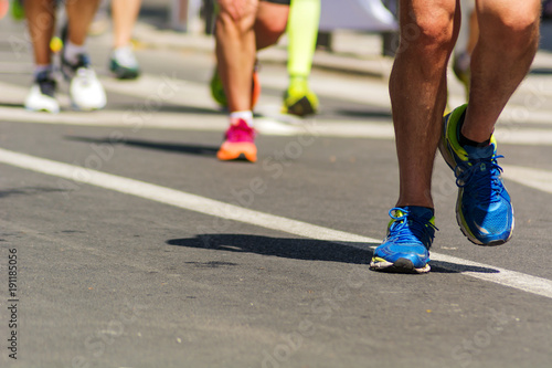 detail of running shoes of marathon runners
