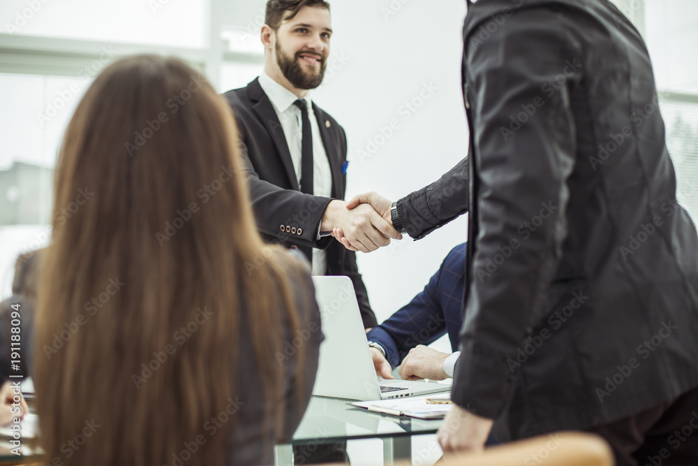 handshake business partners before discussing a new contract handshake business partners before discussing a new contract