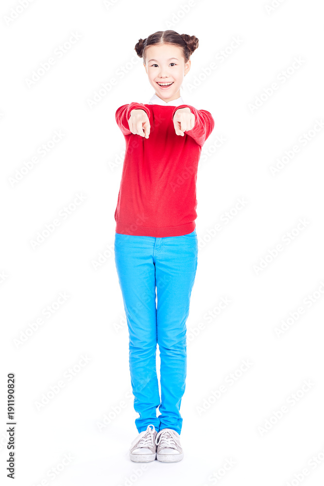 Portrait of cute Asian school girl in red sweater and blue jeans with double buns on her head posing on white background Portrait of cute Asian school girl in red sweater and blue jeans with double buns on her head posing on white background