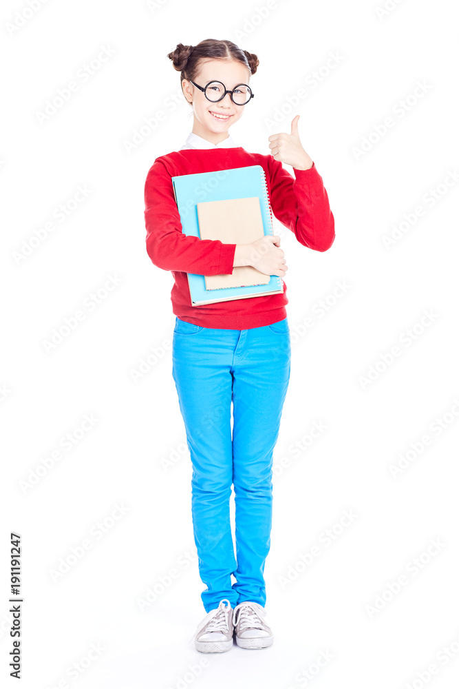 Portrait of female Asian elementary student holding notebook and textbook on white background Portrait of female Asian elementary student holding notebook and textbook on white background