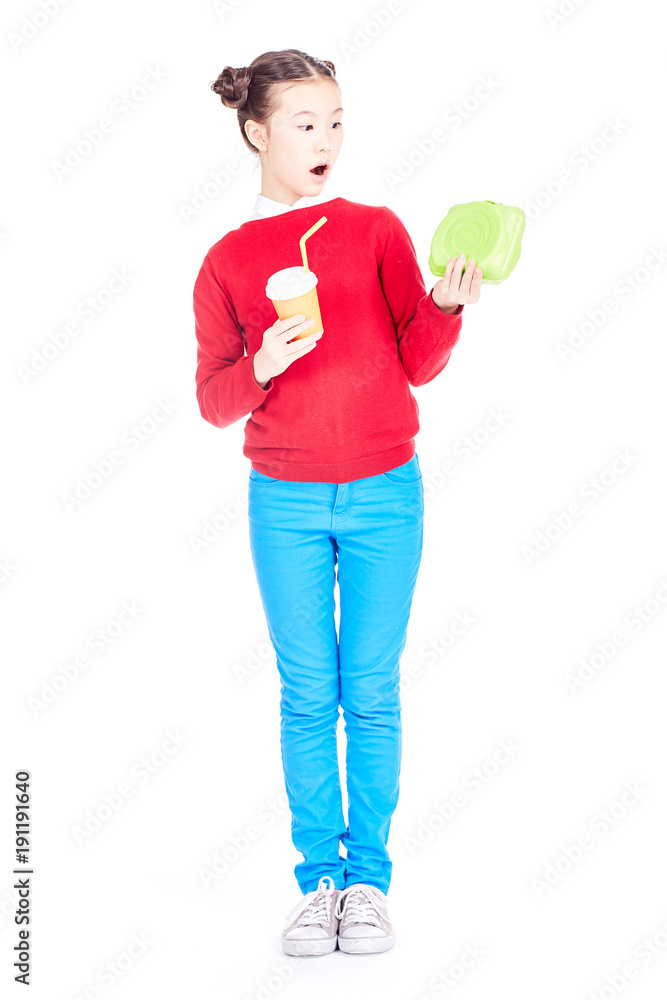 Portrait of cute Asian school girl holding lunch box and paper cup with soft drink isolated on white Portrait of cute Asian school girl holding lunch box and paper cup with soft drink isolated on white
