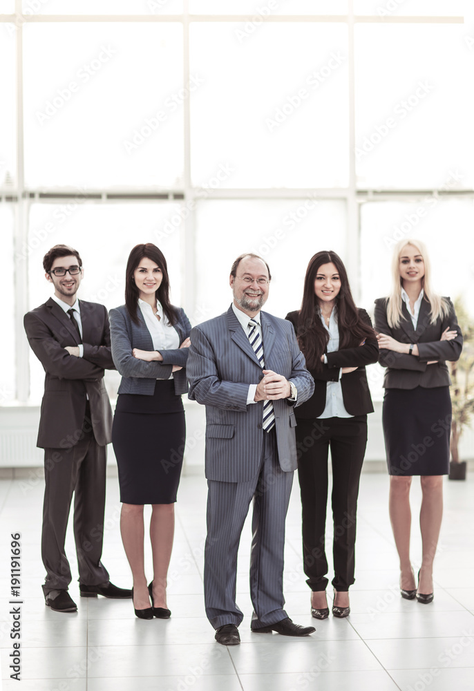 concept of success in business: professional business team on office background concept of success in business: professional business team on office background