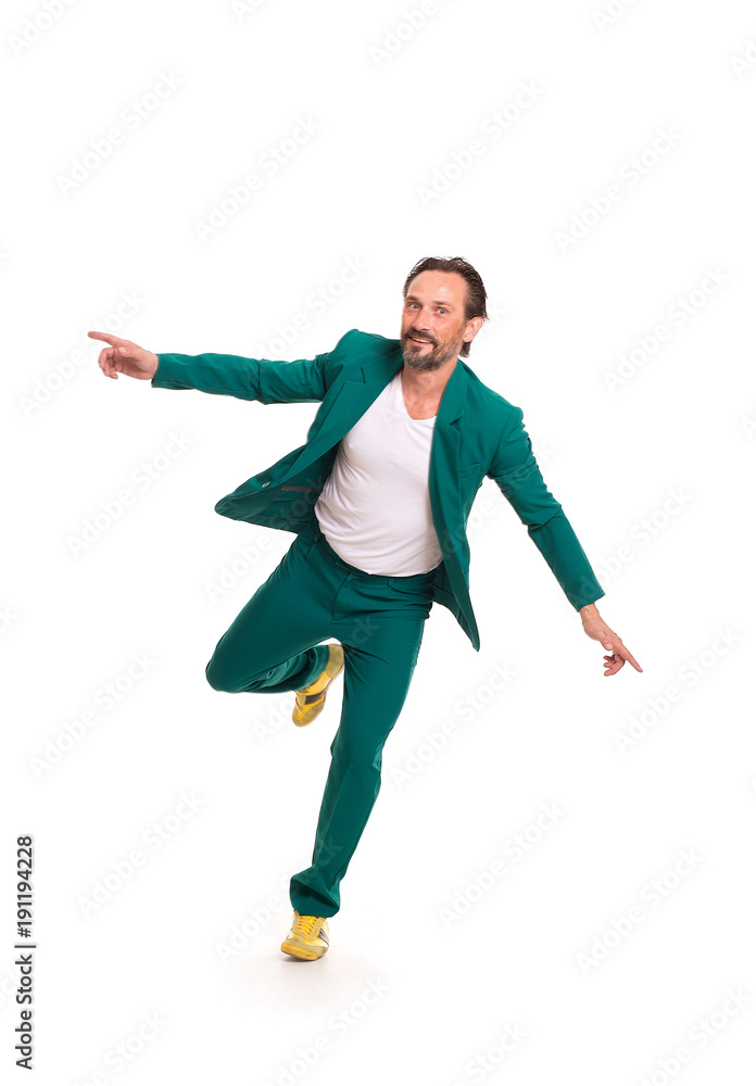 Fototapeta premium Careless man in nice green suit. Immitating flying.