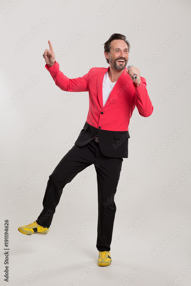 Handsome adult singing in karaoke. Music concept. Handsome adult singing in karaoke. Music concept.