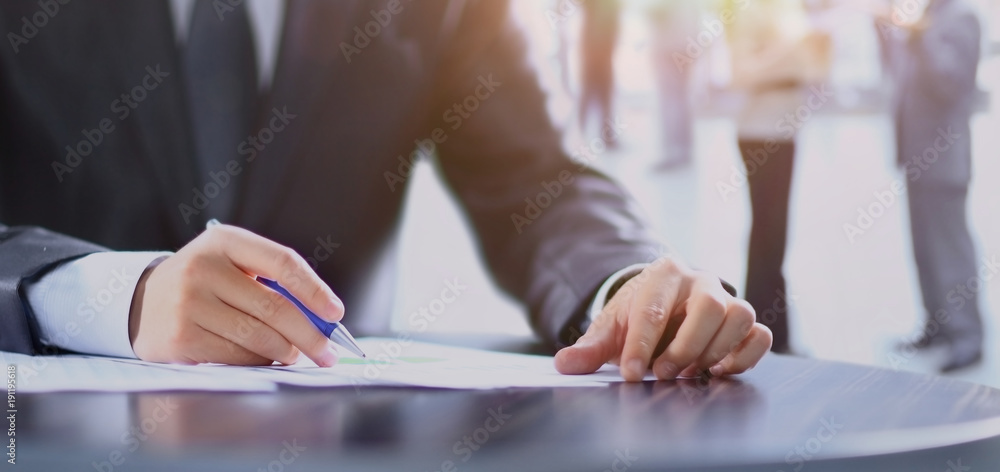 Closeup of human hand writing on a paper. Closeup of human hand writing on a paper.