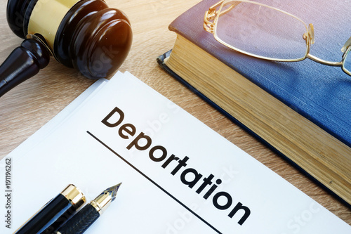 Deportation and other documents on a desk. photo