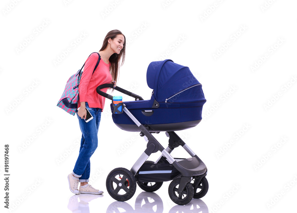 Full length portrait of a mother with a stroller, isolated on white background. Young mom