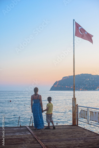 mother and son on the pier ...