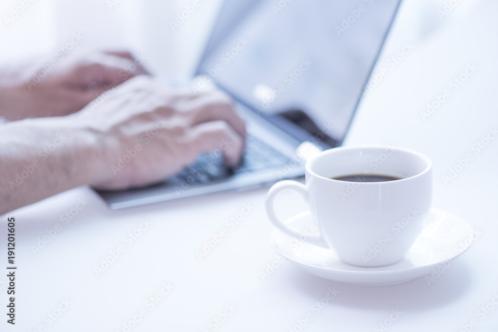 Cup of coffee and modern touch screen notebook. Cup of coffee and modern touch screen notebook.