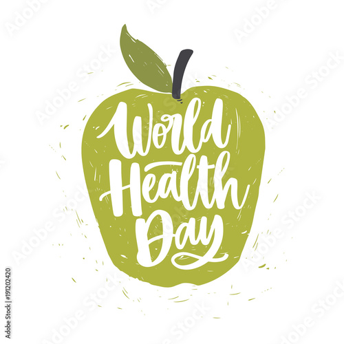World Health Day lettering handwritten with calligraphic font on green hand drawn apple isolated on white background. Fresh fruit with elegant inscription. Bright colored vector illustration.