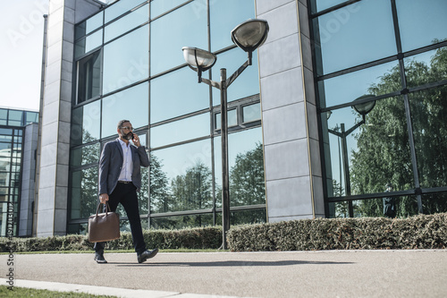 Businessman Talking on Cell Phone © LStockStudio