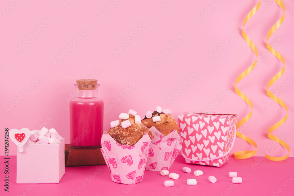 Muffins in colorful paper baking cup with red hearts. Muffins in colorful paper baking cup with red hearts.