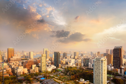Landscape of tokyo city skyline in Aerial view with skyscraper, modern office building and sunset sky background in Tokyo metropolis, Japan. © lukyeee_nuttawut