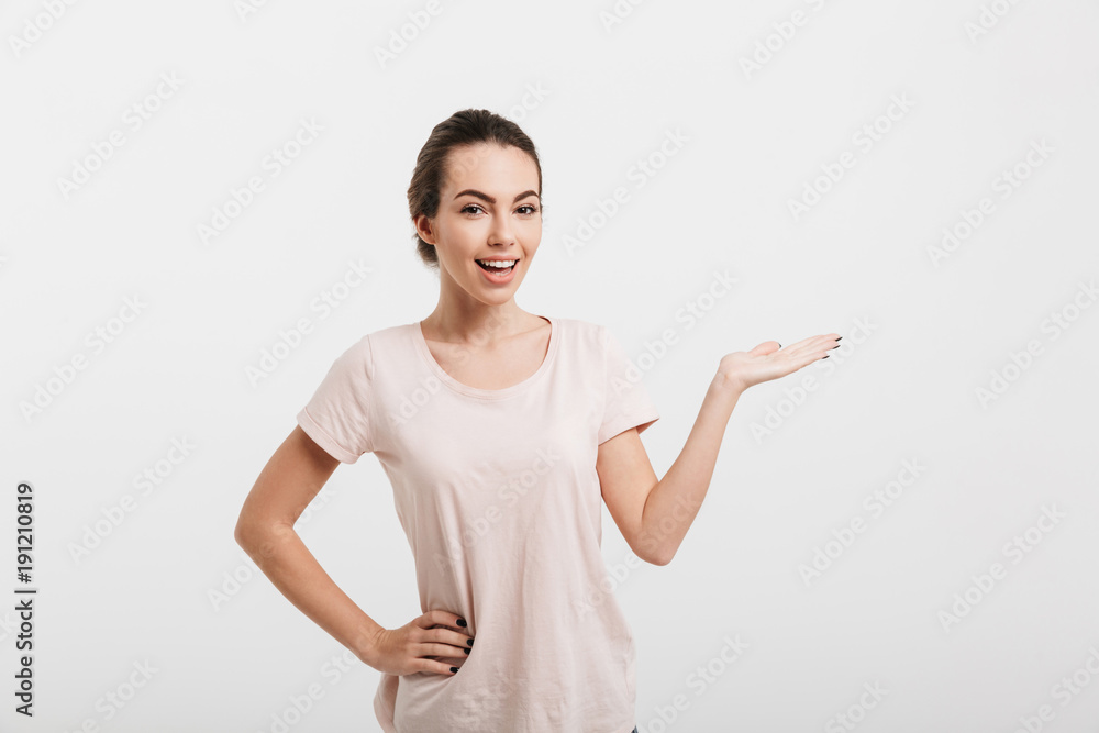 beautiful girl showing something with hand isolated on white beautiful girl showing something with hand isolated on white