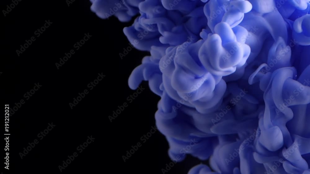 Colored Purple Ink Dropped Into Water. Lovely bright metamorphosis. Cuttlefish ink splatter. volume effect. black background. Violet dye in water. Slow motion. Colored Purple Ink Dropped Into Water. Lovely bright metamorphosis. Cuttlefish ink splatter. volume effect. black background. Violet dye in water. Slow motion.