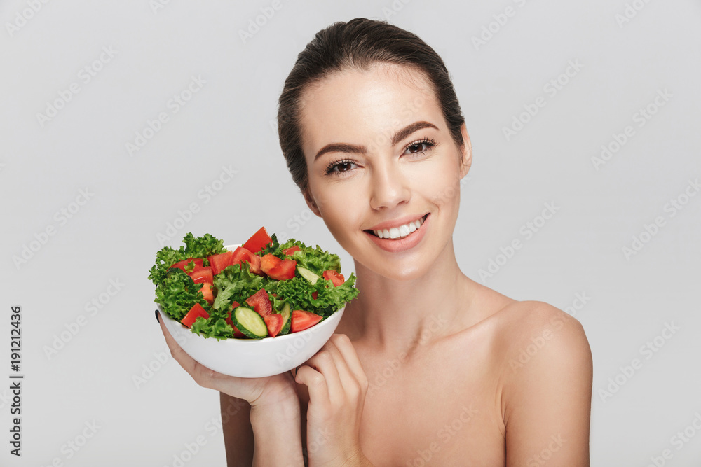 beautiful young woman with bowl of healthy salad isolated on white beautiful young woman with bowl of healthy salad isolated on white