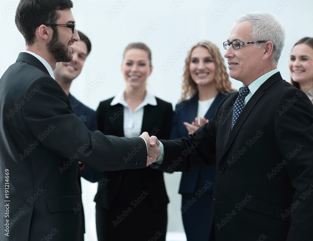 Business handshake and business people conce Business handshake and business people conce