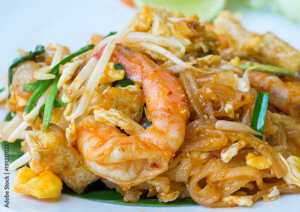 Pad thai with prawn serve in white plate with vegetable Pad thai with prawn serve in white plate with vegetable