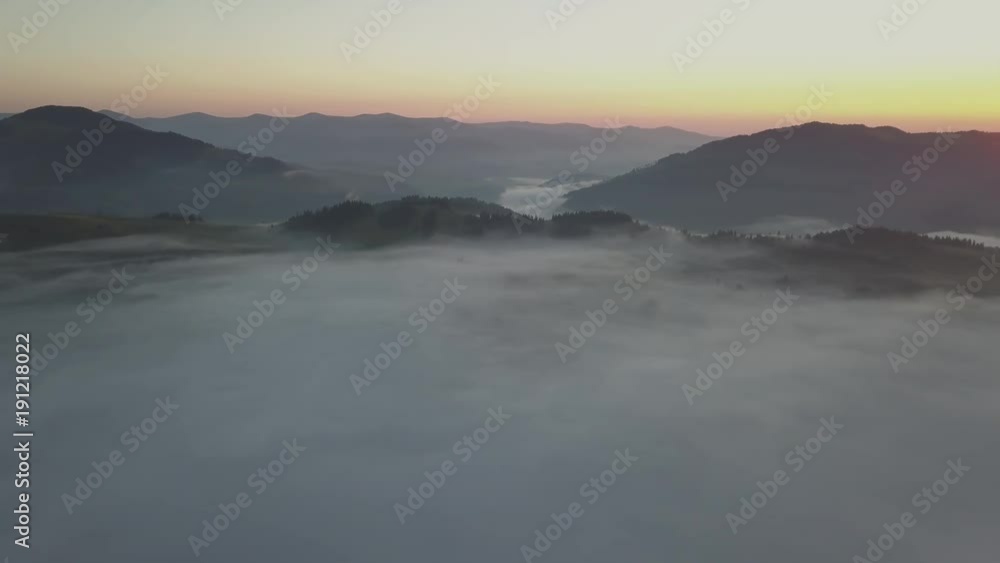 Flying over fog and clouds in Carpathians mountains near by Dzembronya village, Ukraine Flying over fog and clouds in Carpathians mountains near by Dzembronya village, Ukraine