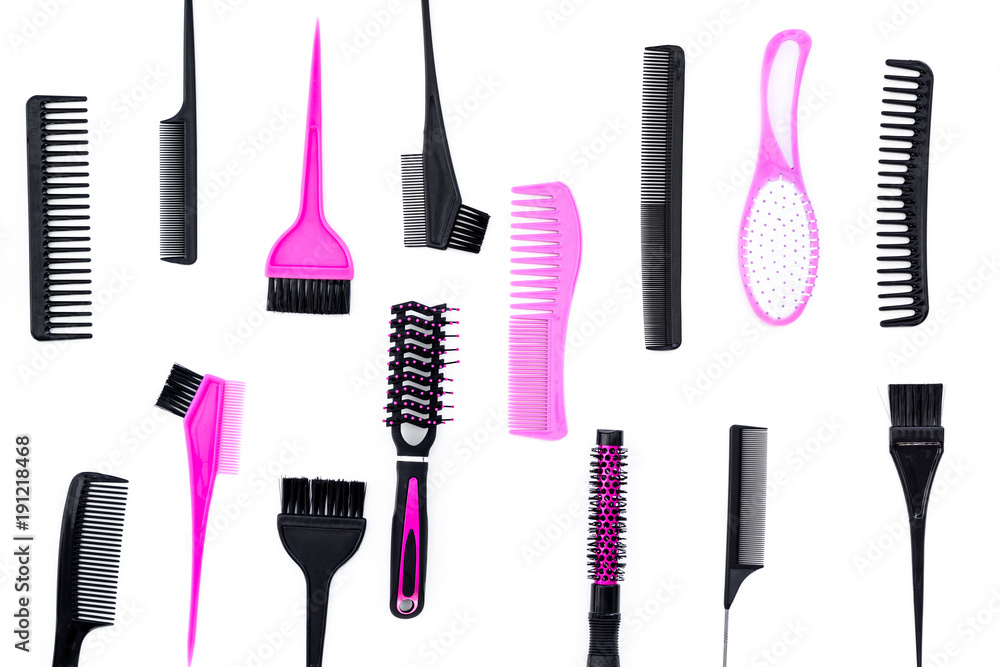 Hairdressing tools. Pattern with various combs and brushes on white background top view