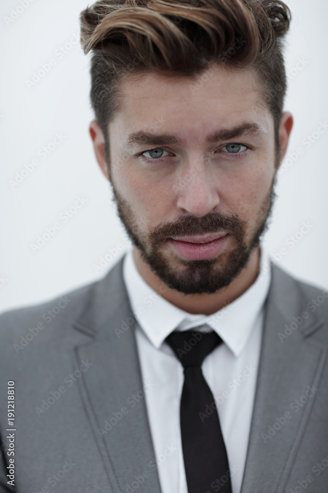 Serious businessman wearing suit and tie. blue background Serious businessman wearing suit and tie. blue background