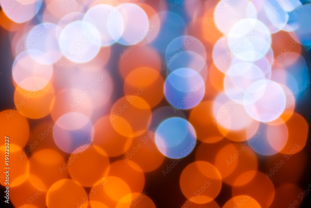Texture from the blurred multicolored circles in bokeh style for design. Defocused lights of the city..