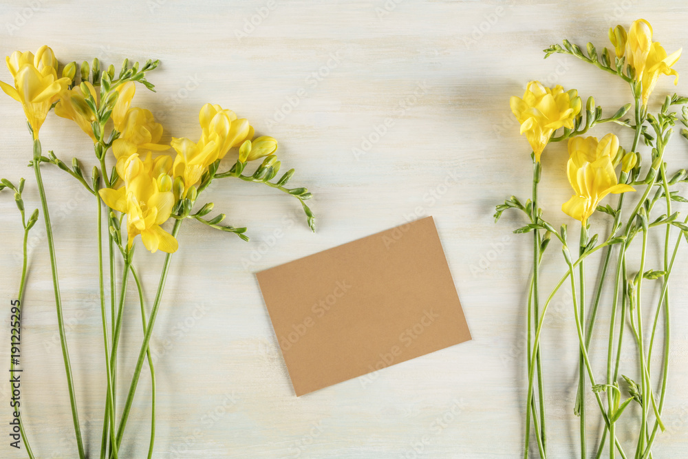 Spring greeting card with freesia flowers and copy space Spring greeting card with freesia flowers and copy space