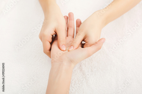Hand massage closeup, acupressure photo