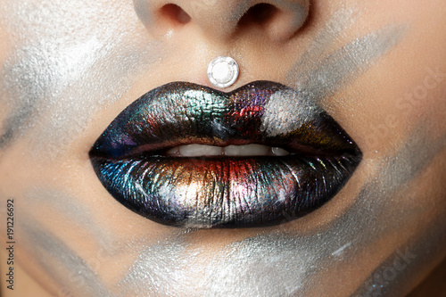 Close up view of woman lips with fashion makeup